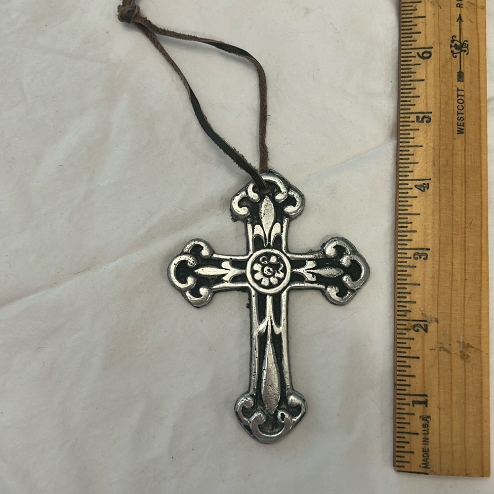 Metal cross with leather tie